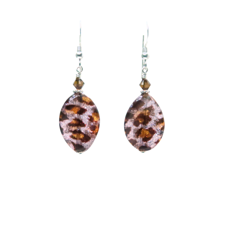 a pair of earrings with red glass beads