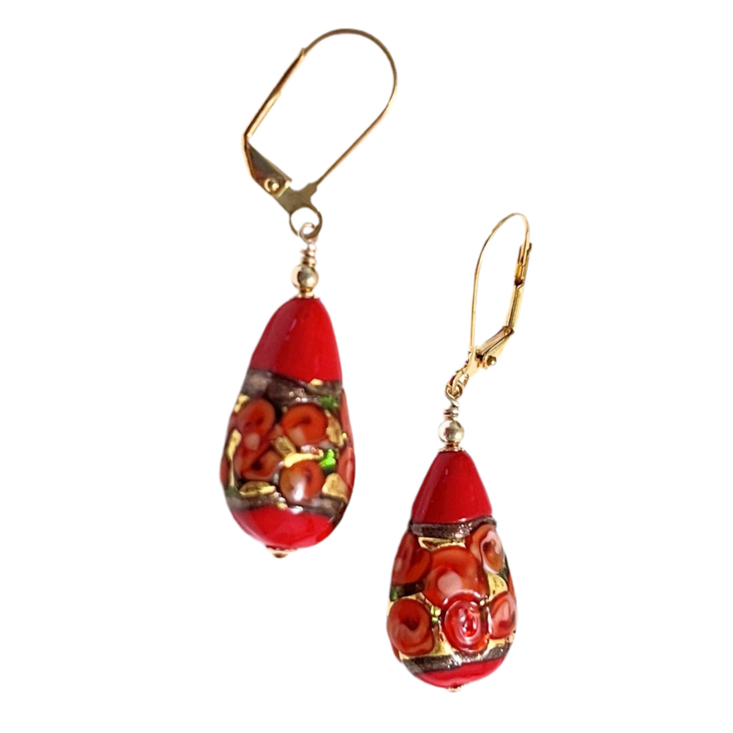 A pair of teardrop-shaped Murano glass earrings with red roses, featuring gold-filled headpins and bead caps, displayed against a white background.