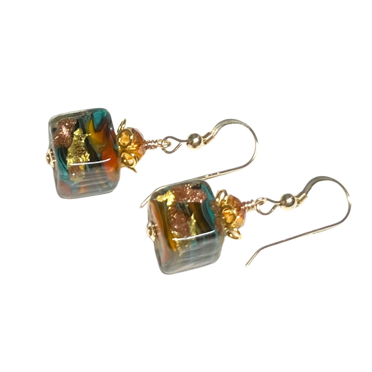 Cube glass earrings with gold accents on a white background