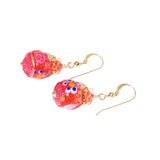 a pair of pink and gold glass beaded earrings
