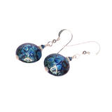 a pair of earrings with blue glass beads