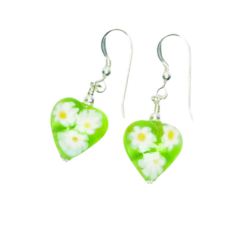 a pair of green and white earrings with daisies