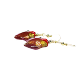 a pair of red and yellow glass earrings
