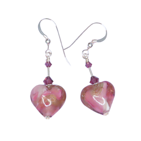 a pair of pink heart shaped glass earrings