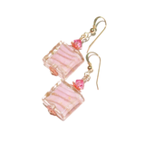 a pair of pink earrings with pink beads