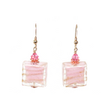 a pair of pink and gold earrings
