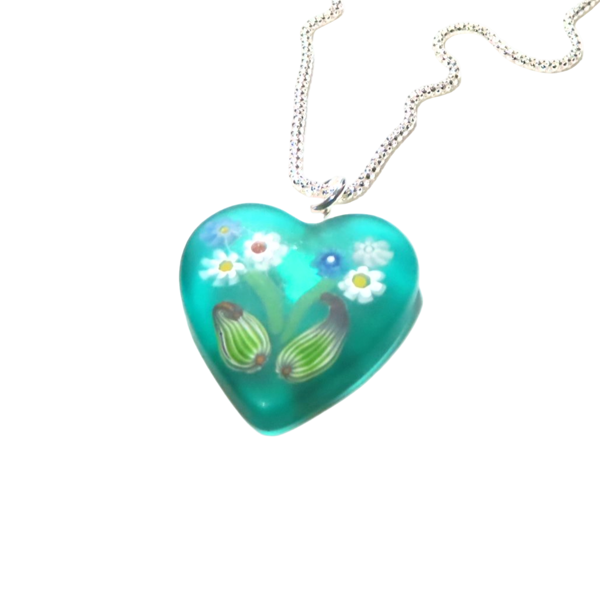 Turquoise heart-shaped pendant with floral design on a white background