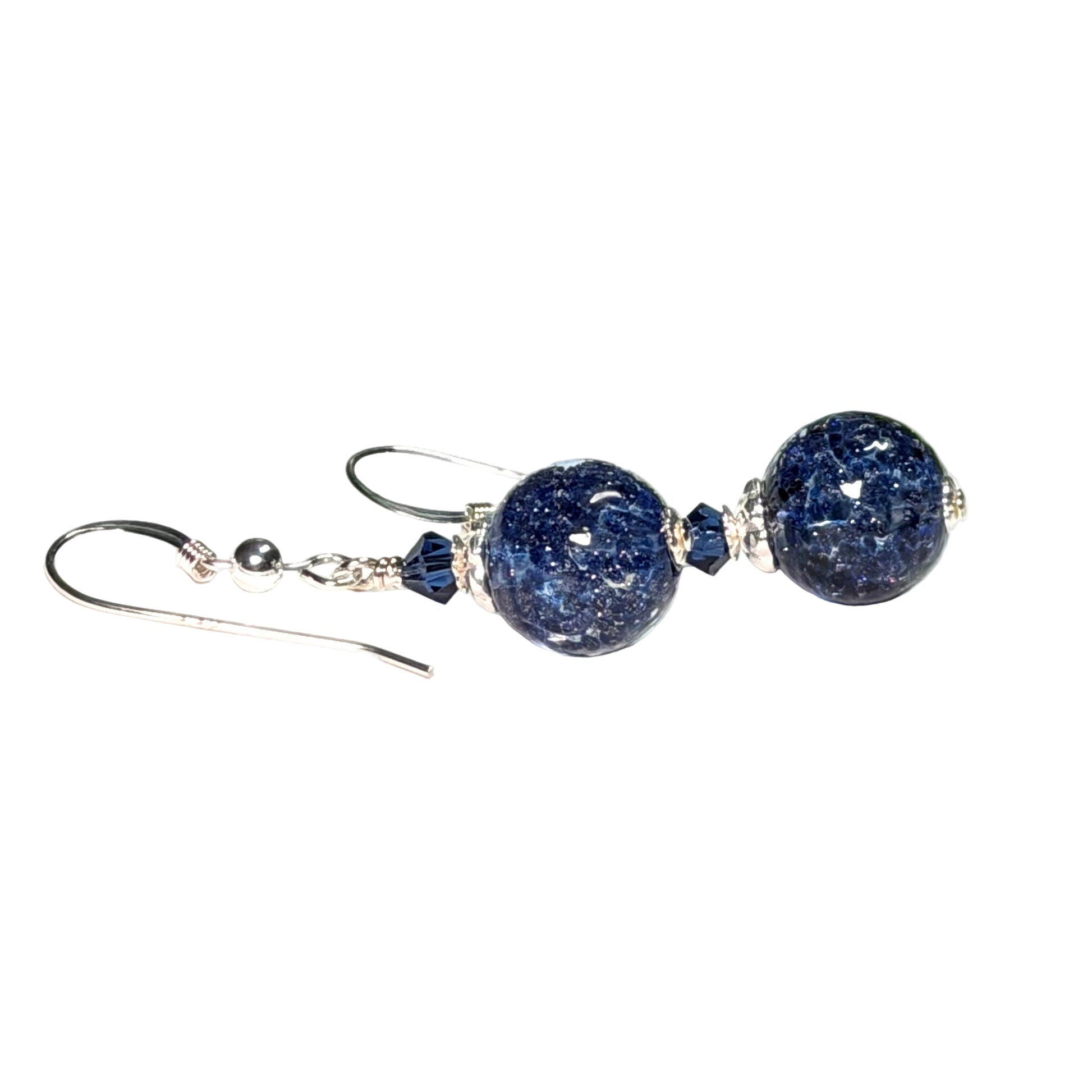 Pair of blue beaded earrings on a white background