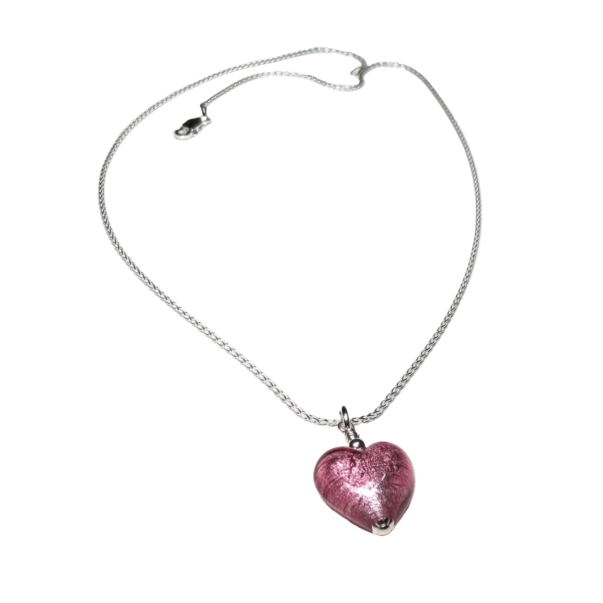 Necklace with a pink heart-shaped pendant on a white background