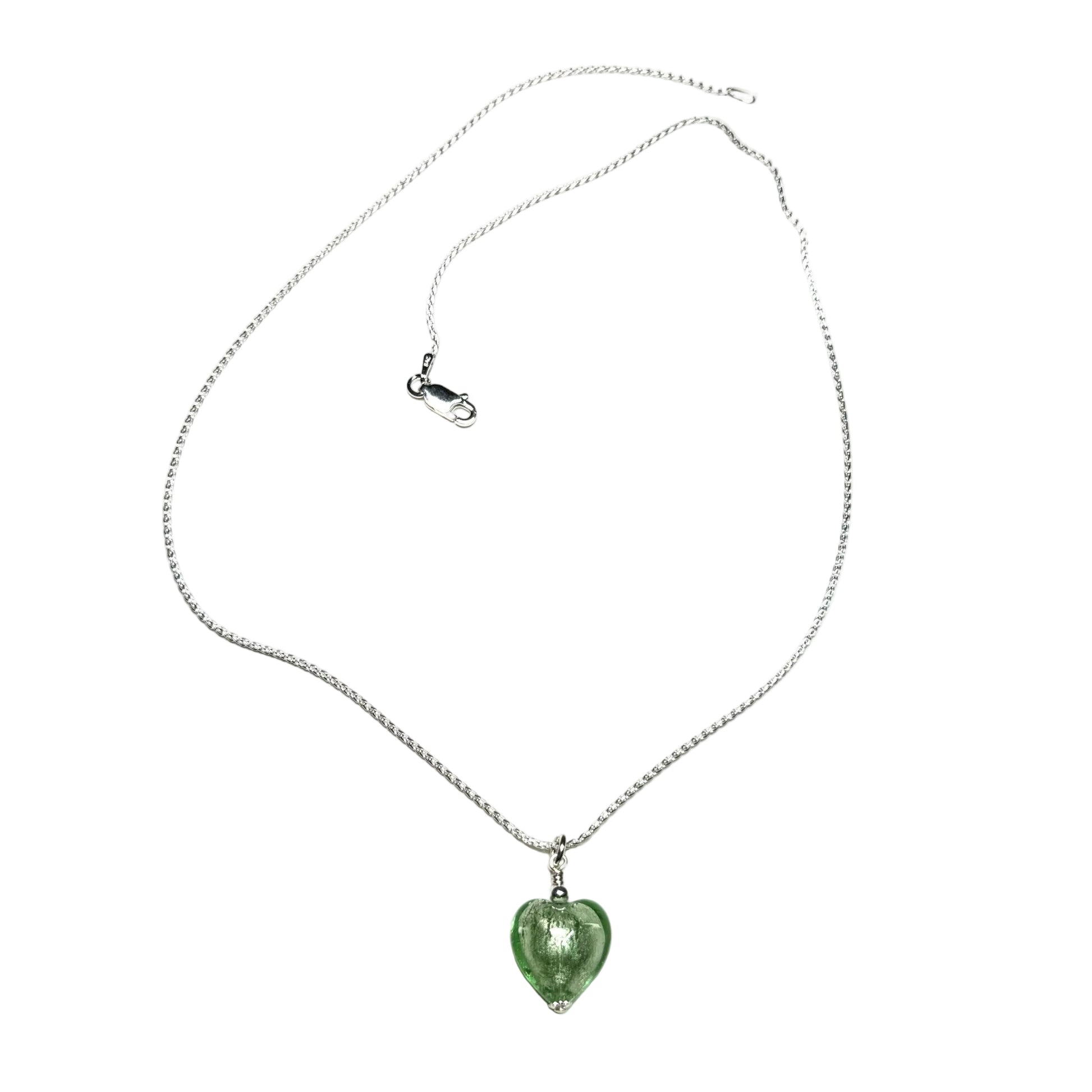 Necklace with a green heart-shaped pendant on a white background