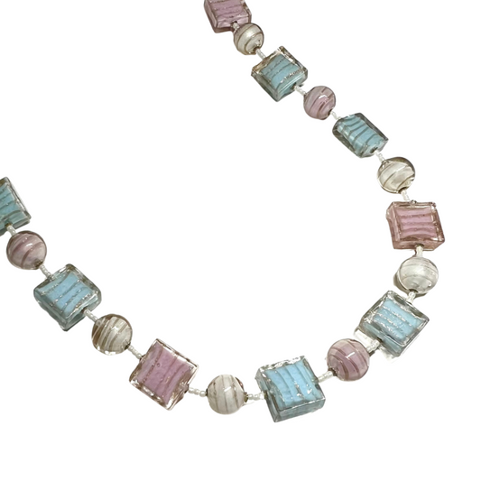 Necklace with pastel-colored beads on a white background