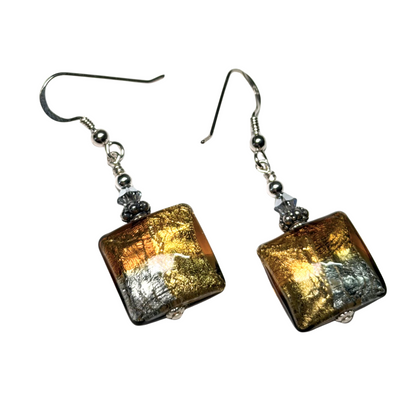 Square-shaped earrings with gold and silver tones on a white background