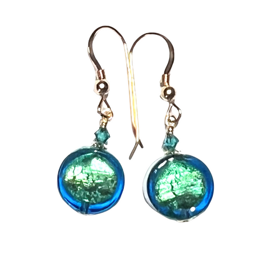 Pair of green beaded earrings on a white background