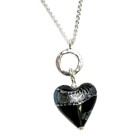 a necklace with a gray dichroic  heart on a chain