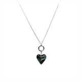 a heart shaped pendant on a silver chain