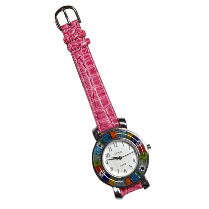 A women's watch featuring a vibrant pink crocodile-embossed strap and a round dial with a colorful mosaic tile border.