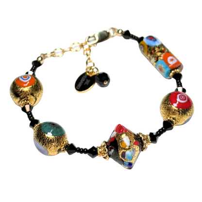 Colorful beaded bracelet with gold accents on a white background