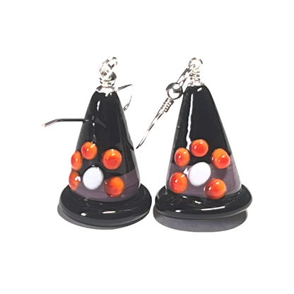 Halloween-themed cone-shaped earrings with orange and white balls on a white background