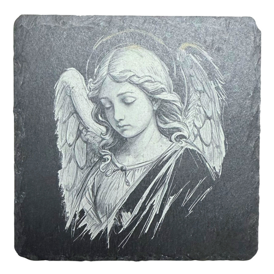 Slate coaster with engraved angel design on a white background