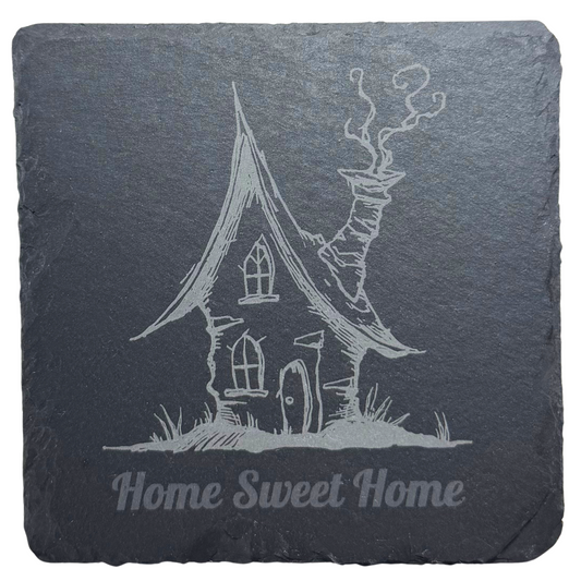 Slate coaster with engraved house illustration and 'Home Sweet Home' text on a white background