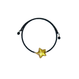 a bracelet with a gold star on it