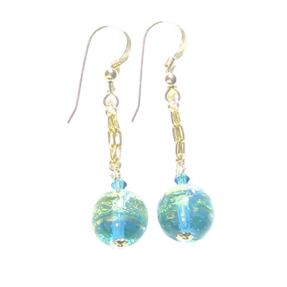 Pair of earrings with blue and gold beads on a white background