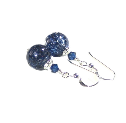 Pair of blue beaded earrings on a white background