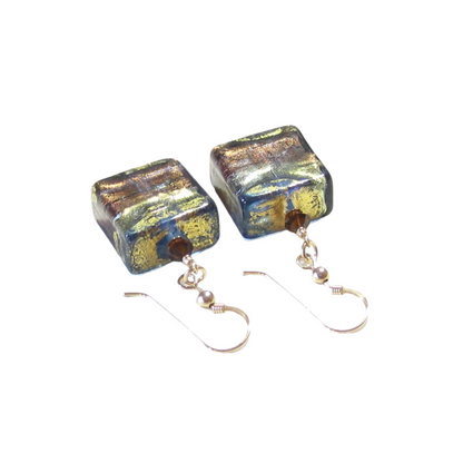 Pair of square glass earrings with metallic sheen on a white background