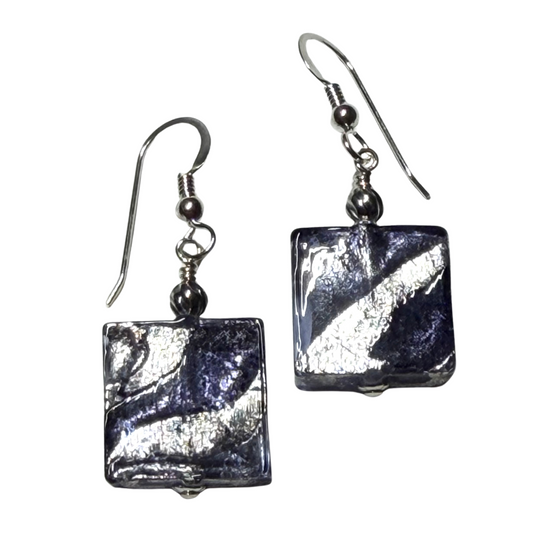 Pair of square-shaped earrings with metallic blue finish on a white background