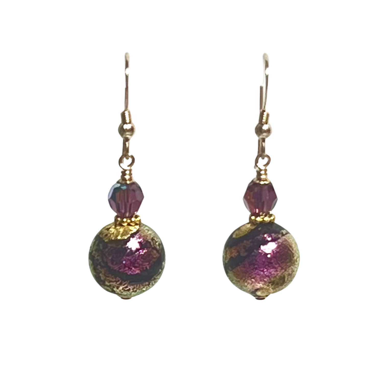 Pair of earrings with pink and gold beads on a white background