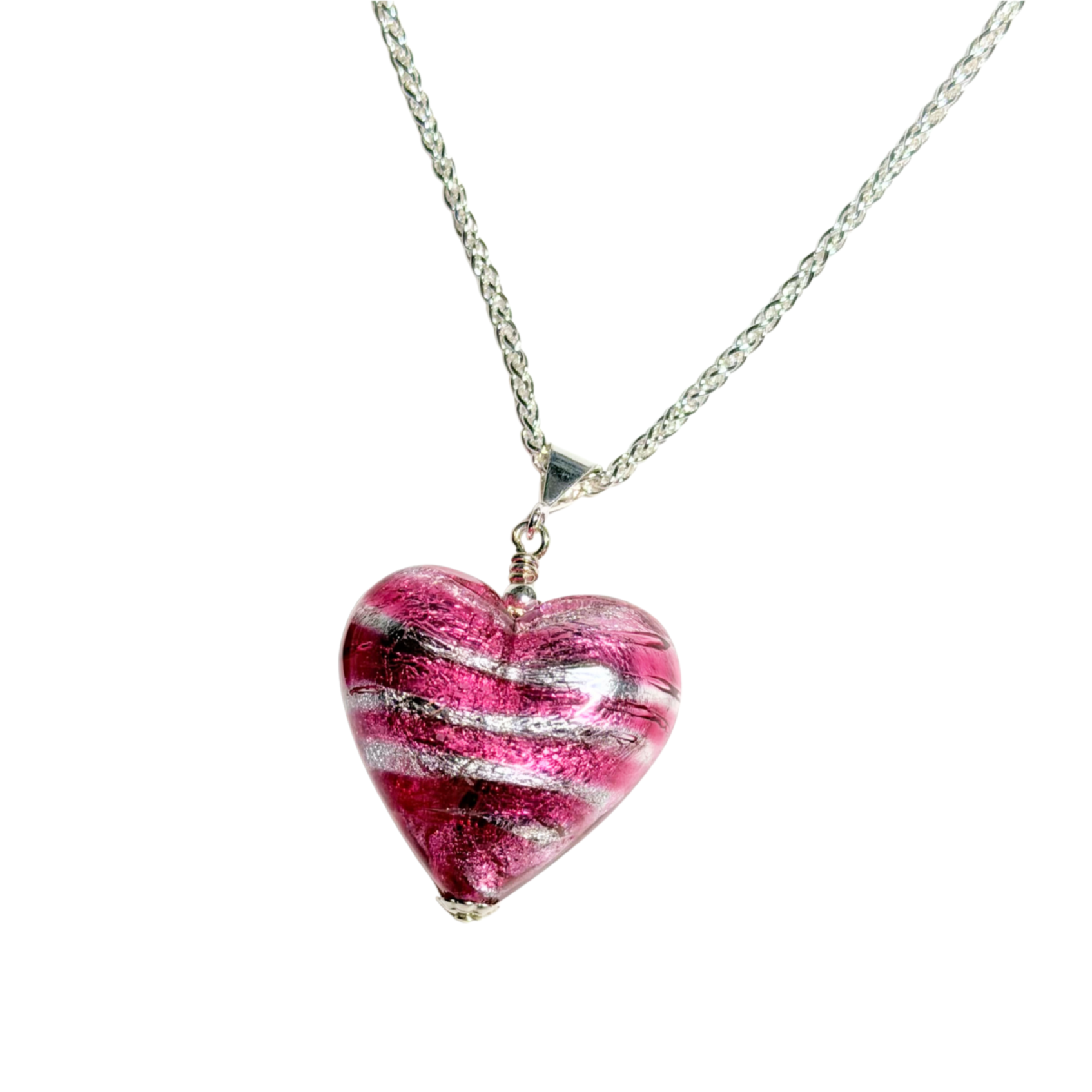 Heart-shaped pink and white striped pendant on a silver chain against a white background