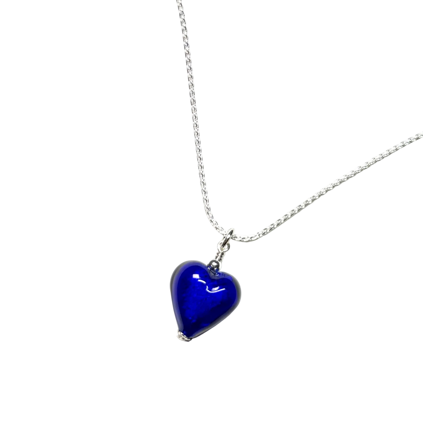 Blue heart-shaped pendant on a silver chain against a white background