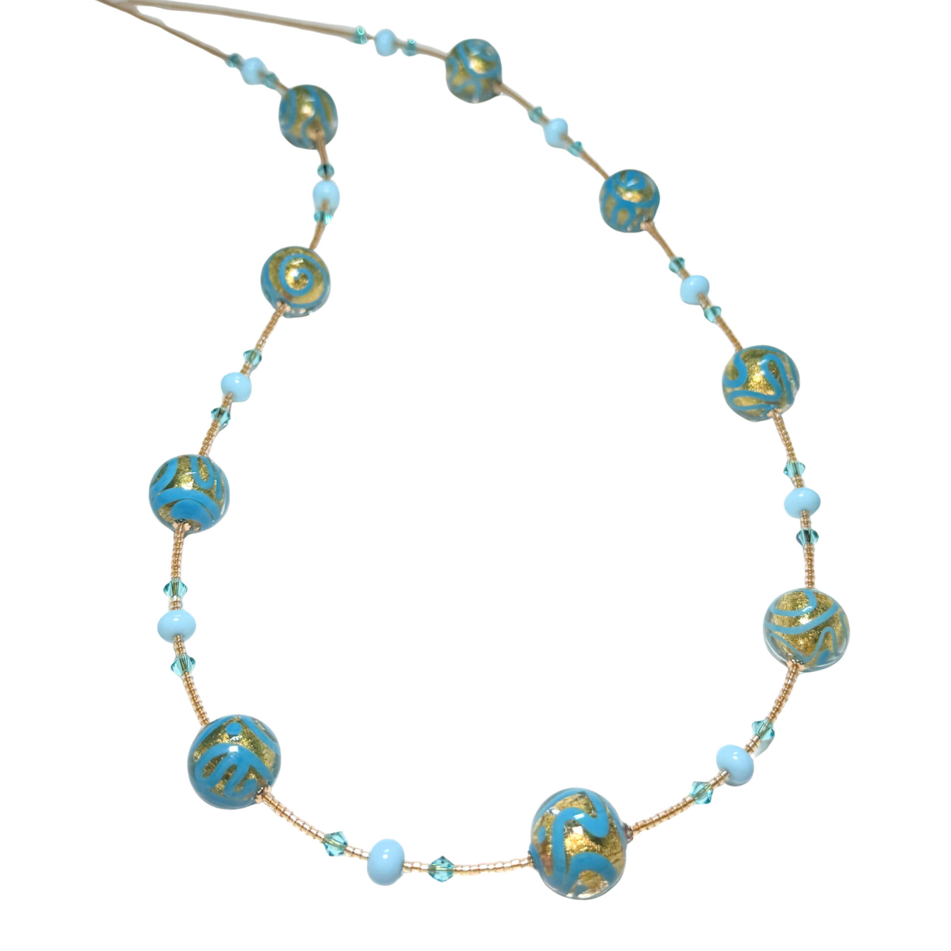 Necklace with turquoise and gold beads on a white background