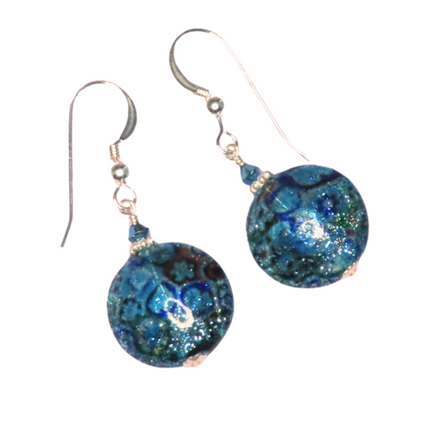 a pair of earrings with blue and green designs
