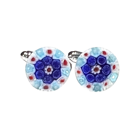Pair of round cuff links with a floral design on a white background