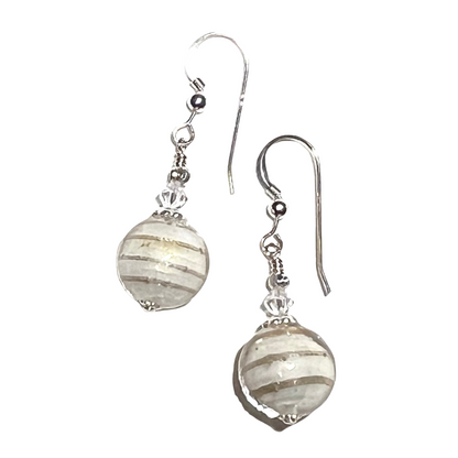 Pair of Murano glass cream round, striped beads on a white background