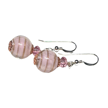A pair of Murano pale pink copper ball sterling silver earrings with a round shape and copper line detailing.
