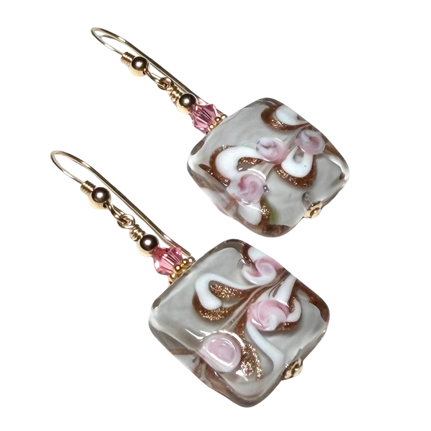 Pair of earrings with floral design on a white background