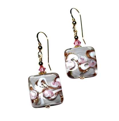 Square glass earrings with floral design and gold accents on a white background