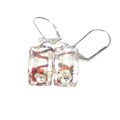 Pair of square-shaped earrings with colorful interior on a white background
