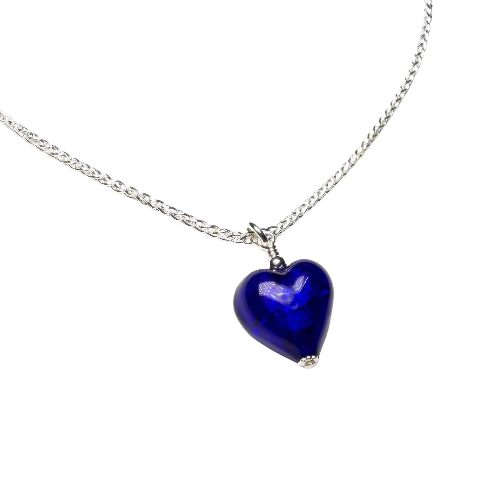 Necklace with a blue heart-shaped pendant on a white background