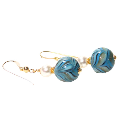 A pair of Murano glass turquoise dangle earrings with gold-filled wire and bead caps.