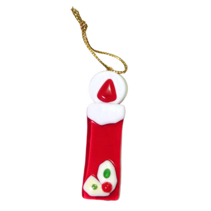 A red candle-shaped Murano glass ornament with white and green details, hanging from a gold-colored string.