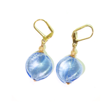 a pair of earrings with blue glass beads