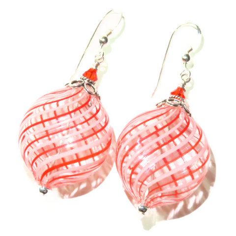 a pair of orange and white 
 blown glass earrings