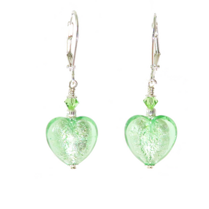 a pair of green glass heart shaped earrings