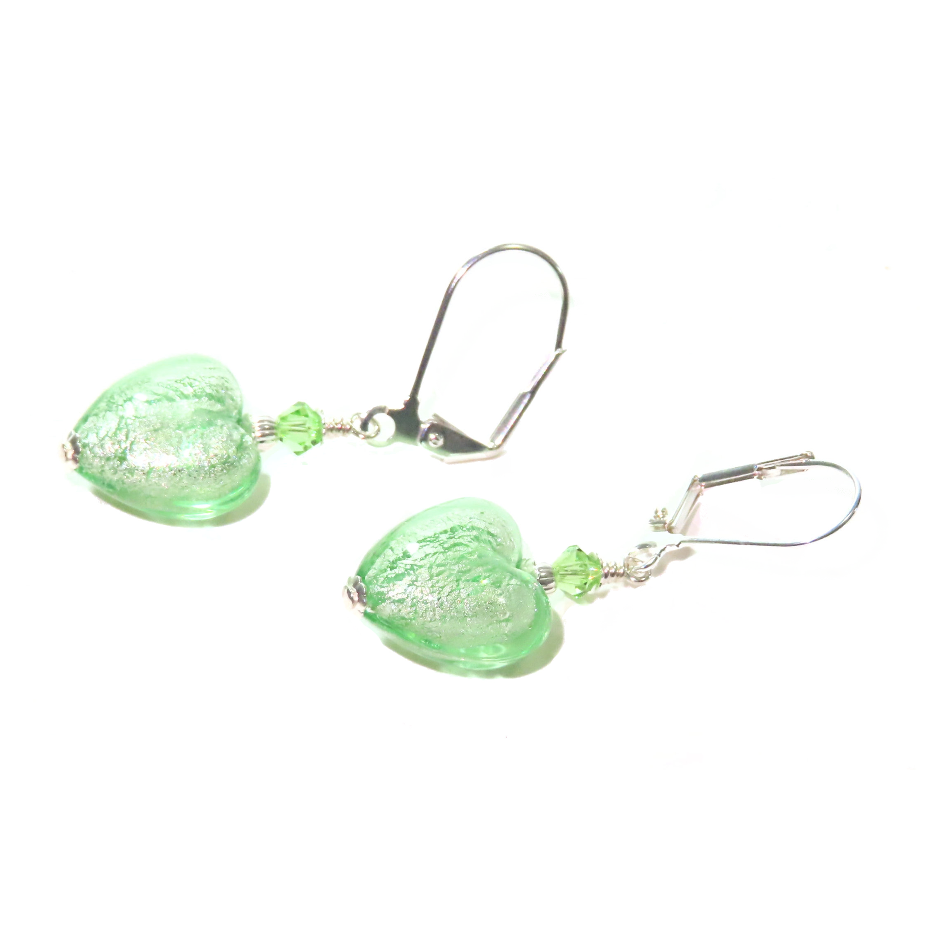 a pair of green glass earrings on a white background