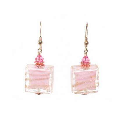 a pair of pink and gold earrings