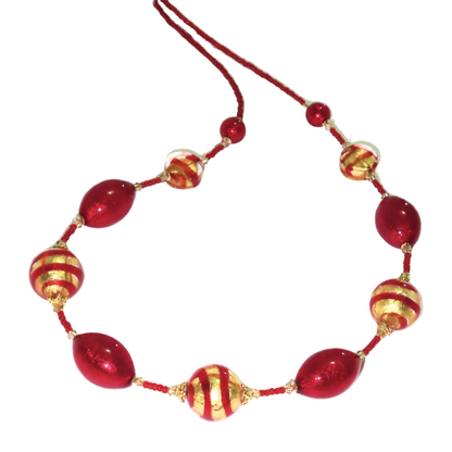 Necklace with red and gold beads on a white background